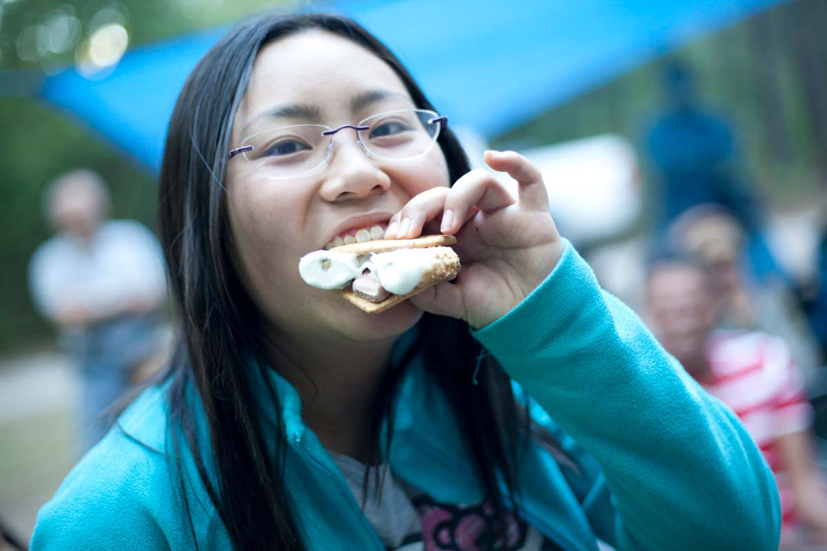 Person eating smores